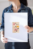 woman holding a loose watercolor flowers watercolor bouquet - Flavia Bennard
