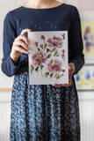 woman holding pink loose watercolour flowers bouquet painting Flavia Bennard